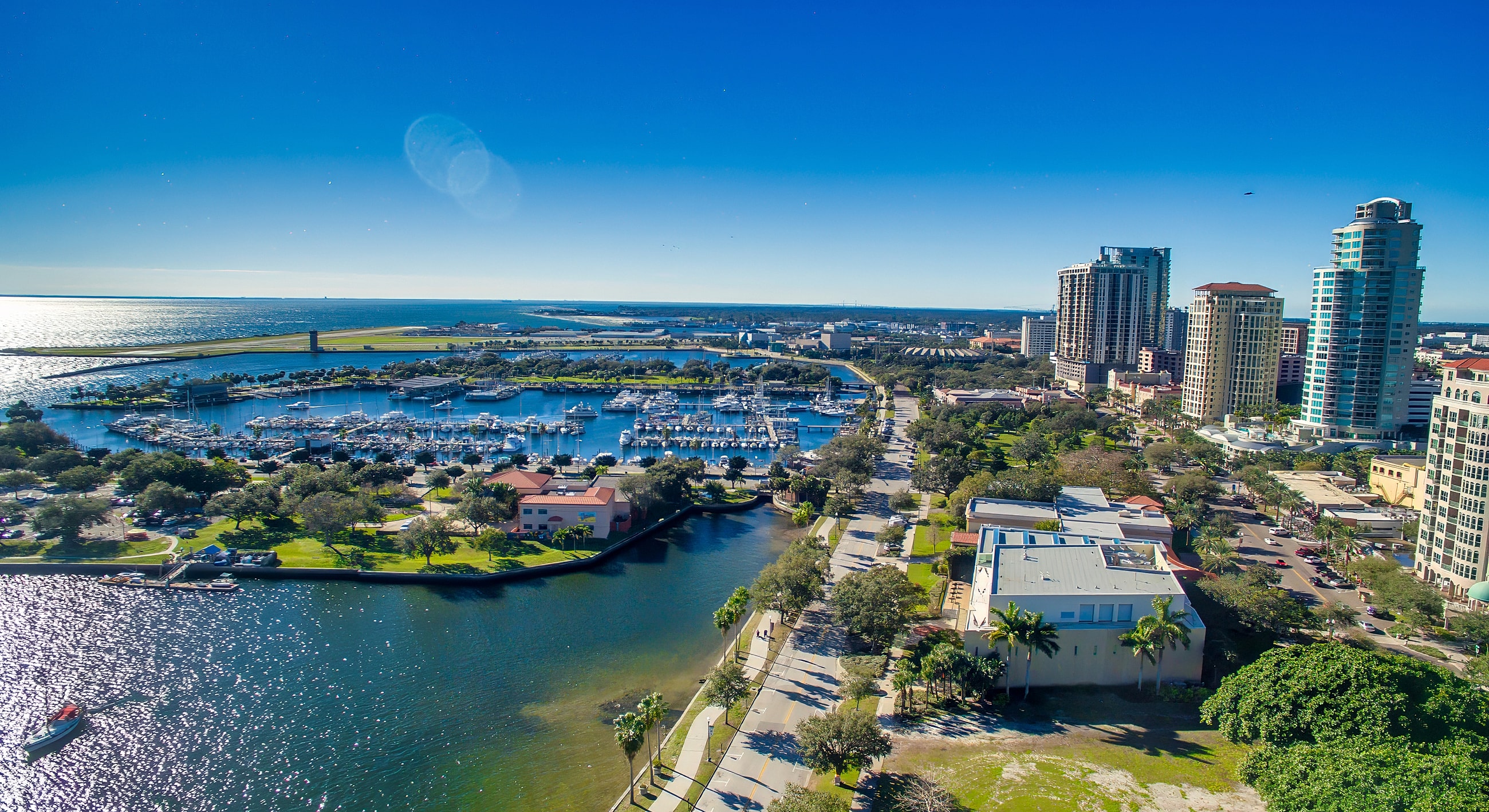 Cityscape with marina and waterfront views.